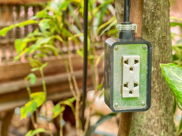 Ground-fault circuit interrupter (GFCI), adhering to ANSI E1.19-2021, used to protect electrical equipment for stage lighting setup in an entertainment production outdoor environment.