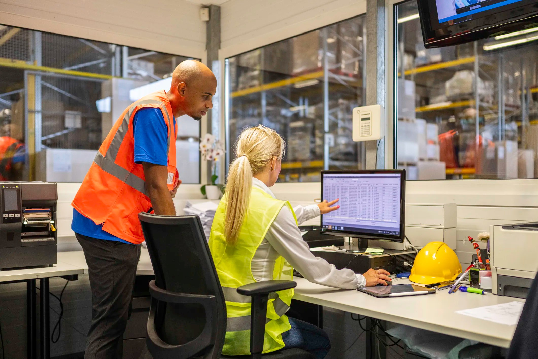 control operators conducting quality management, adhering to ISO 9001, in a warehouse facility.