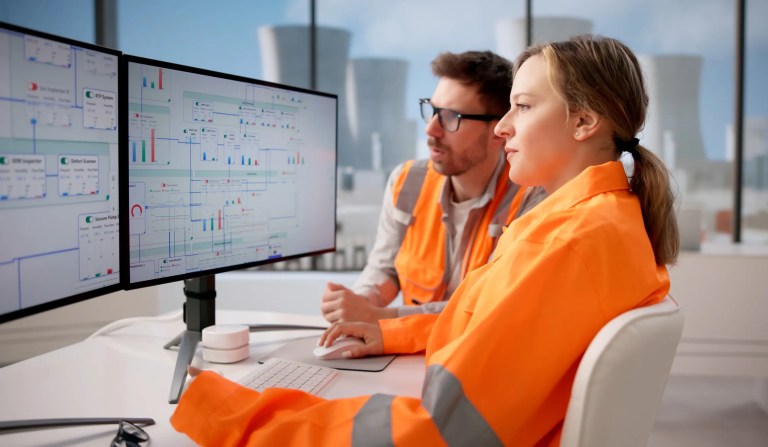 Scientist analyzing engineering simulation software on a computer, emphasizing user needs, data interpretation, and reliable technical performance and adherence to ANSI/ANS-10.5-2006 (R2026).