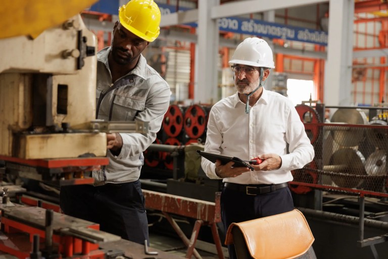 Professional businessman reviewing quality management system processes aligned with the ISO 9001 QMS standard for operational efficiency and continuous improvement.