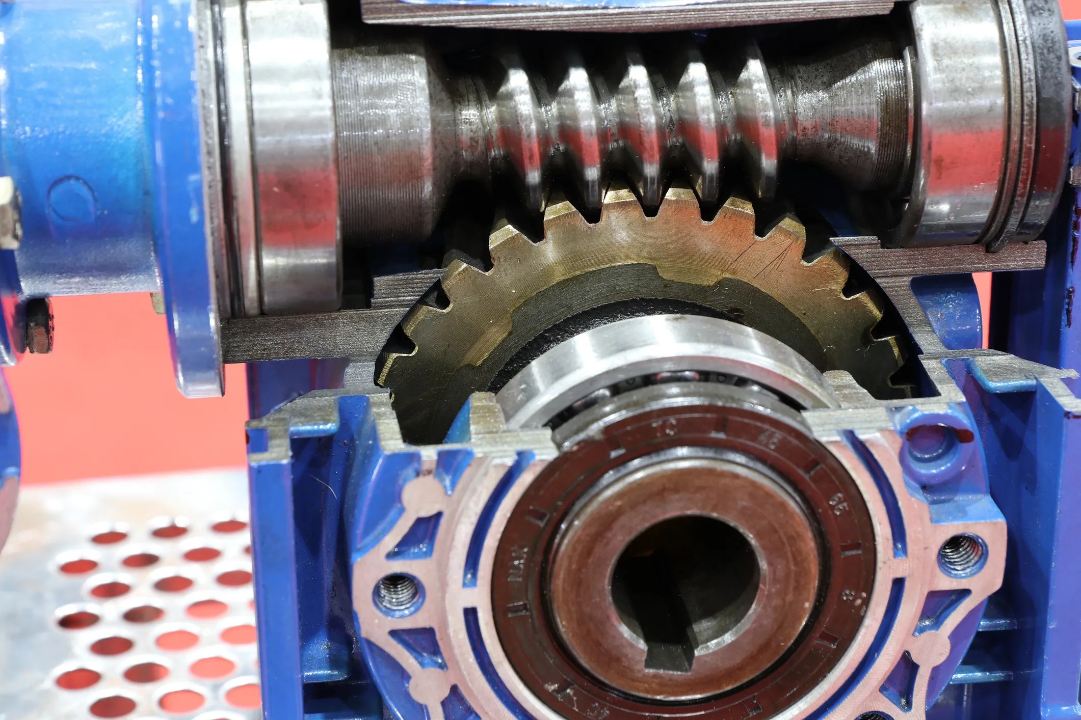 Industrial wormgear speed reducer and gearmotor used in automated manufacturing equipment, as covered by ANSI/AGMA 6134-C21.