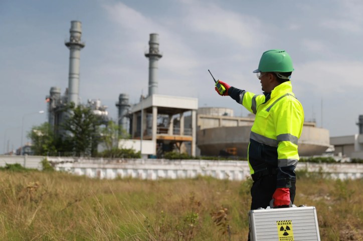 Security personnel monitoring and controlling nuclear materials at a protected nuclear facility in accordance with ANSI N15.28-2021 qualification and certification guidance.