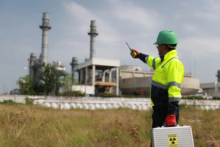 Security personnel monitoring and controlling nuclear materials at a protected nuclear facility in accordance with ANSI N15.28-2021 qualification and certification guidance.