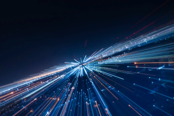Light streaks blasting from small box in darkness to represent SMBs embracing innovation.