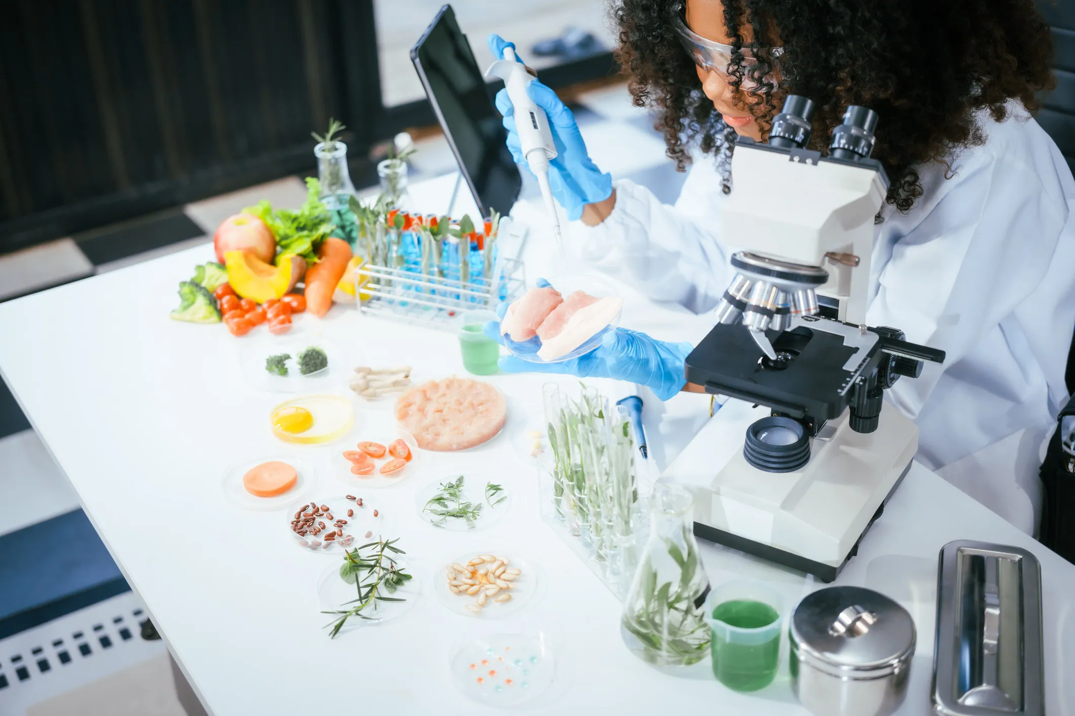 Scientist testing fresh fruits and vegetables for pesticide residues in a food safety laboratory, illustrating regulatory monitoring, laboratory analysis, and consumer protection.