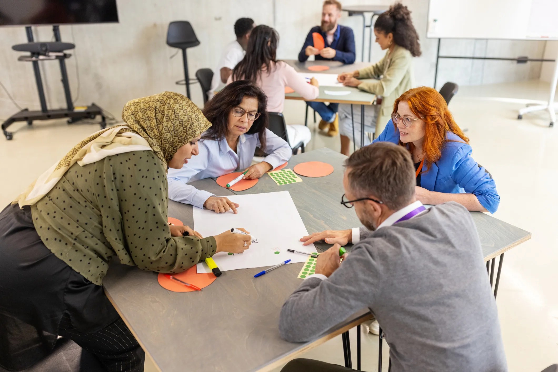ANSI/IACET 1-2018 continuing education and training framework showing professionals engaged in learning, skills development, and workplace training.