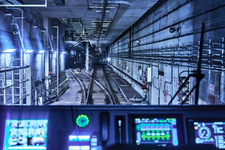 APTA-SS-CC-03-15 [2015] rail transit cybersecurity showing a modern train, digital control systems, and connected communications infrastructure protected against cyber risks.