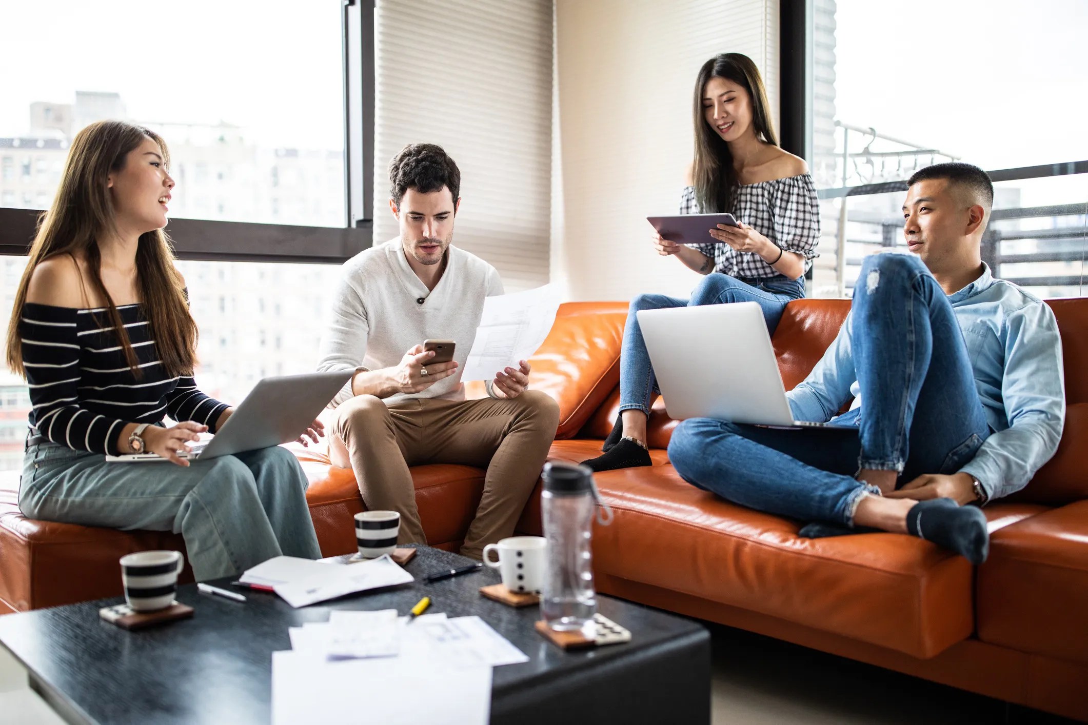 Business professionals securely accessing cloud-based virtual desktop services, adhering to ATIS-0200006 requirements, from laptops and mobile devices across multiple locations.