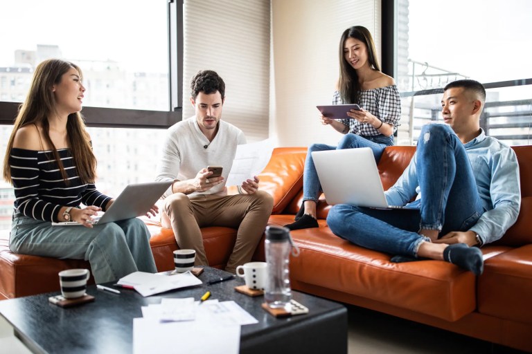 Business professionals securely accessing cloud-based virtual desktop services, adhering to ATIS-0200006 requirements, from laptops and mobile devices across multiple locations.