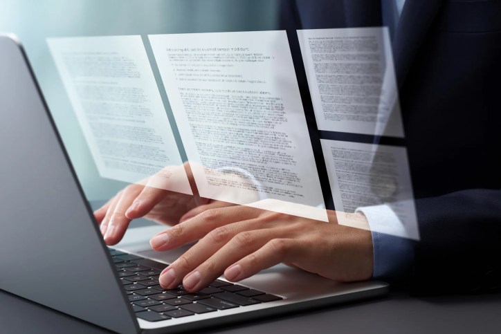 Professional reviewing ANSI Webstore standards on a computer while comparing edition years, publishers, and document versions before purchase.