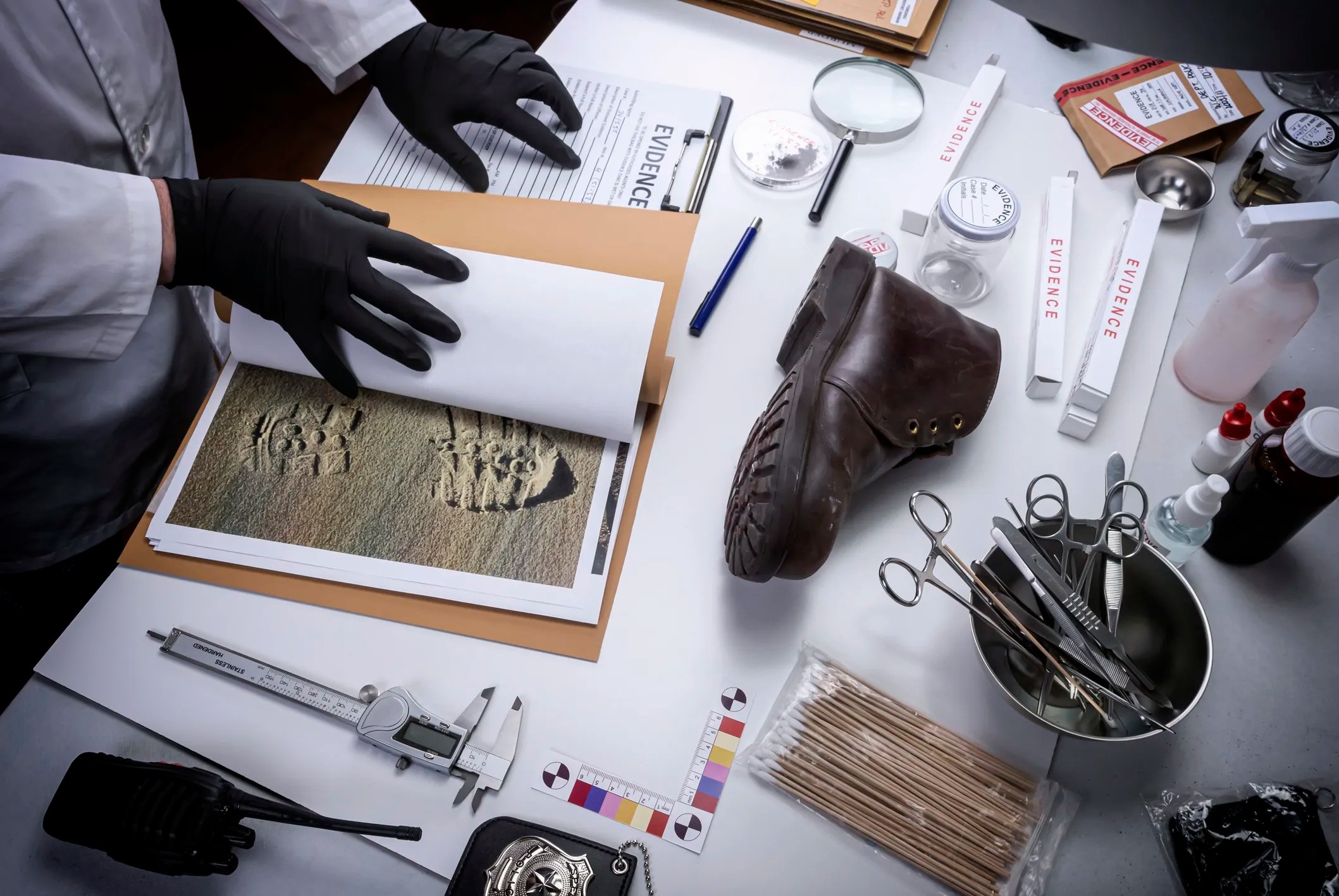 Forensic professional examining evidence while learning about cognitive bias and human factors in forensic decision making.