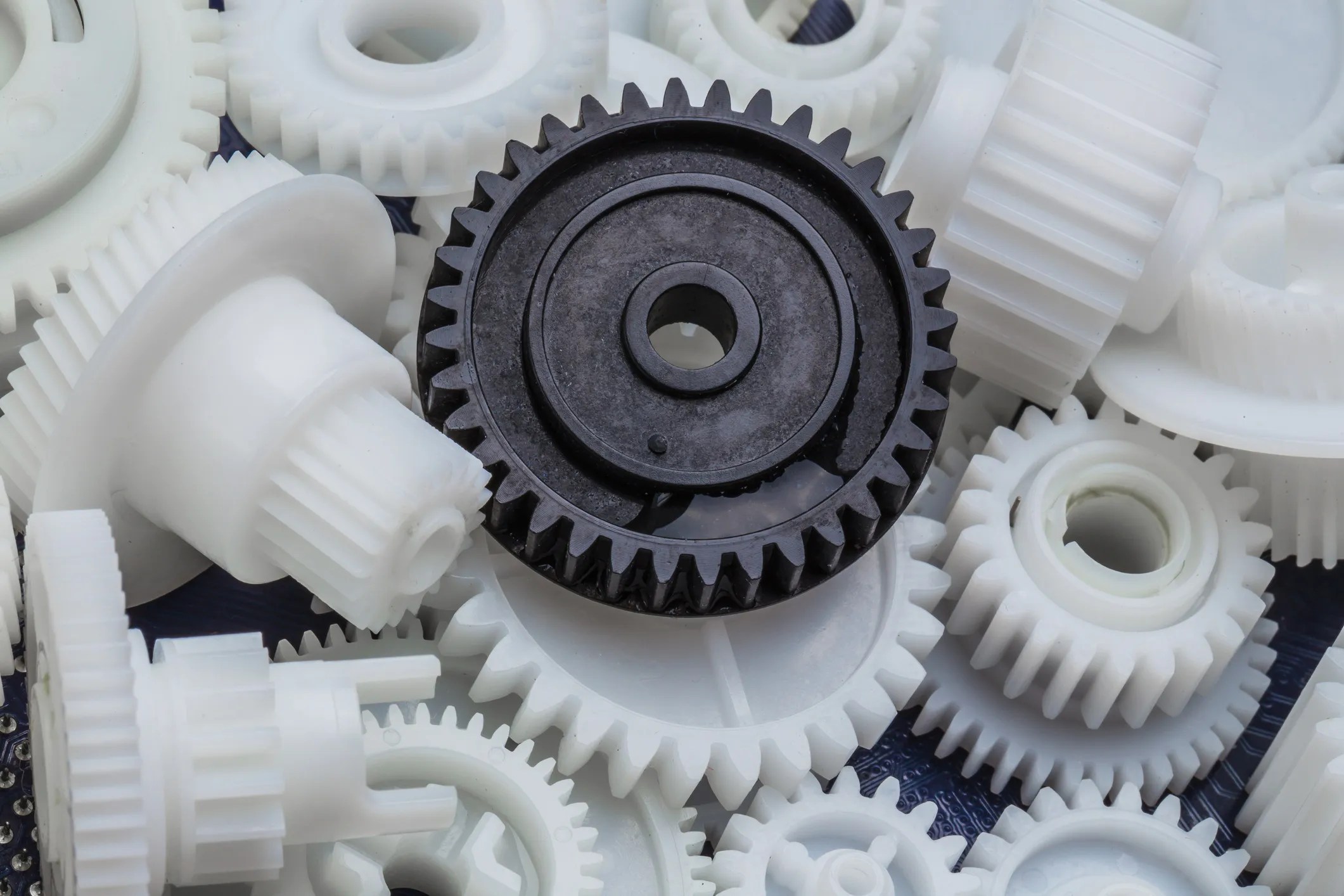 Molded plastic gears undergoing inspection and measurement in accordance with AGMA 905-A17, focusing on measurement accuracy and repeatability.